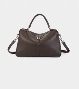 Detail view of women genuine leather Boston handbag, elegant commuter shoulder crossbody bag.