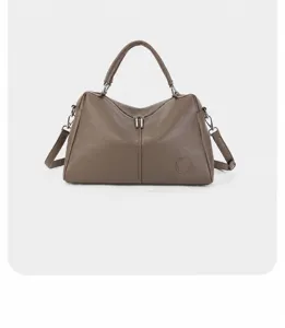 Genuine leather Boston handbag detail view, premium cowhide shoulder bag in elegant taupe.