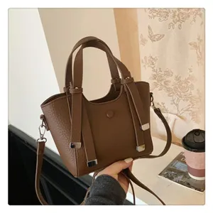 Brown leather tote shoulder bag for women, large capacity stylish commuting handbag.