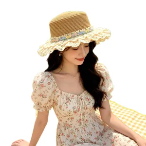Stylish women straw sun hat with lace trim and floral ribbon for beach vacation summer outdoor.