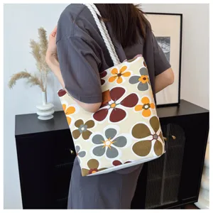 Vintage floral canvas tote bag for women, large capacity shoulder bag with comfortable handles.