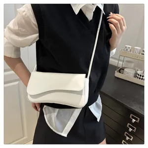 White underarm shoulder bag detail, minimalist flap crossbody design, stylish casual daily look.