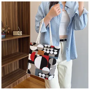Canvas tote bag with stylish geometric print, large shoulder handbag for women daily casual use.