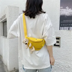 Detailed view of cute canvas chest bag with lovely plush bear accessory for women and girls.