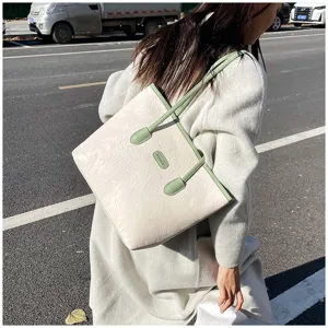 Large capacity women tote bag stylish embossed shoulder bag for daily commute wear.