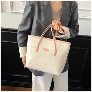 Large capacity embossed women tote bag, stylish shoulder bag for daily commute and autumn use.