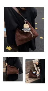 Brown suede hobo shoulder bag for women with cute knitted puppy plush pendant for autumn.