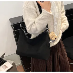 Black casual shoulder bag for women large capacity hobo tote bag with cute dog pendant.