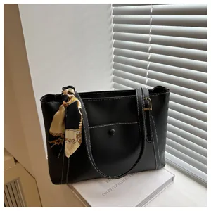 Black commuter tote bag with scarf decor, large capacity casual leather handbag for women.