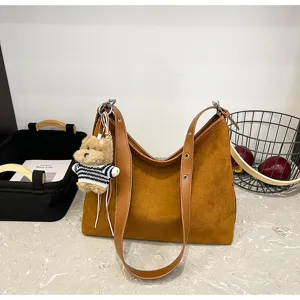 Brown suede hobo shoulder bag with cute bear pendant, casual slouchy tote for women.
