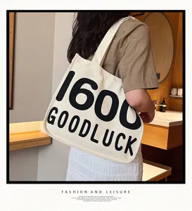 Canvas tote bag for women, casual single shoulder shopping bag with fashion letter print.