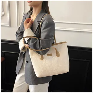 Detailed view of the women large capacity embossed tote bag, stylish shoulder bag design.