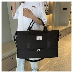 Große schwarze gesteppte Reisetasche Duffel Bag mit Schultergurt und Schuhfach.
