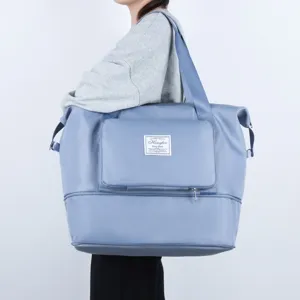 Large capacity foldable travel duffel bag with wet dry separation for gym sports and weekend trips.