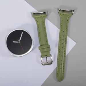Green leather watch strap detail shot, soft texture and exquisite metal buckle design.