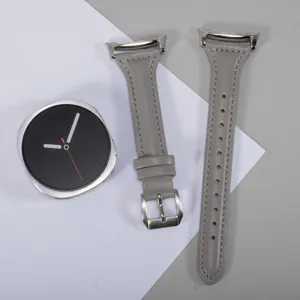 Detailed view of the slim waist leather watch strap, highlighting premium gray texture and stitching.