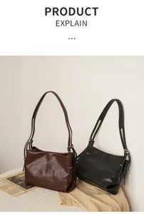 Detail view of the minimalist vegetable-tanned cowhide shoulder bag showcasing fine texture.