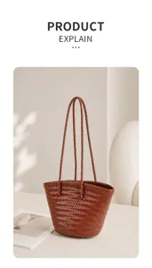Detailed view of the brown woven leather bucket bag showing fine handcrafted texture and straps.