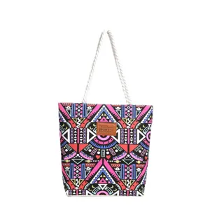Canvas tote bag detail view, colorful geometric printed pattern, casual shoulder handbag.