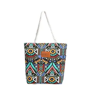 Detailed view of the colorful geometric canvas tote bag featuring sturdy white rope handles.