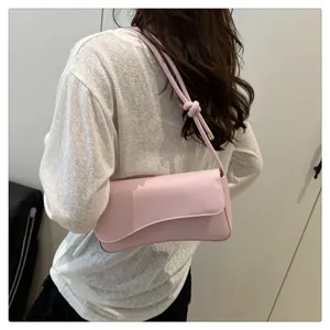 Pink underarm shoulder bag for women, stylish minimalist design, casual crossbody bag daily use.