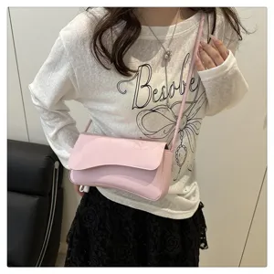 Pink underarm shoulder bag for women, stylish minimalist design casual handbag for daily use.