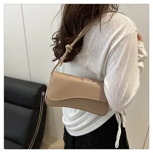 Chic beige shoulder underarm bag detail shot showing fashionable daily style and smooth texture.