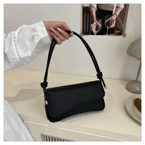 Fashion minimalist black shoulder bag for women, chic PU leather underarm bag with knot strap.