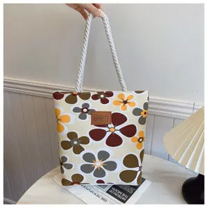 Stylish canvas tote bag with retro floral print, large capacity casual shoulder bag for women.