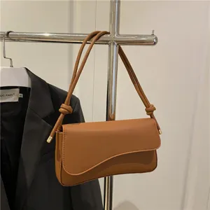 Stylish brown leather underarm shoulder bag for women, minimalist baguette crossbody bag.