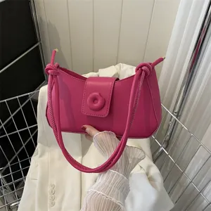 Sac à épaule rose minimaliste et élégant, sac besace de travail décontracté pour femme moderne.