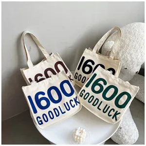 Canvas tote bag for women, literary style single shoulder handbag with letter print design.