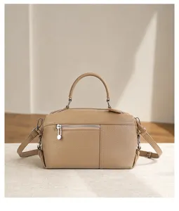 Premium top layer cowhide leather handbag detail view, showing fine stitching and texture.