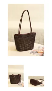 Detailed view of brown leather woven tote bag, showcasing premium texture and craftsmanship.