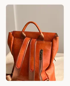 Detail view of vintage vegetable-tanned leather backpack for daily commuting and school.