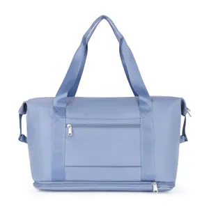Large capacity blue travel gym bag with wet dry separation compartment and sturdy handles.