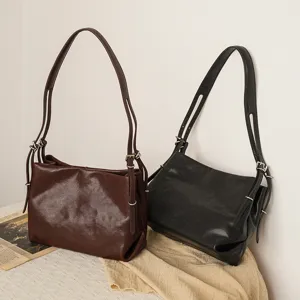 Minimalist crystal vegetable-tanned cowhide shoulder bag, versatile commuting handbag.