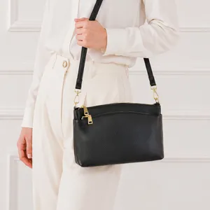 Black genuine leather shoulder bag for women, stylish crossbody handbag with gold hardware.