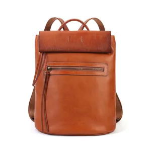 Vintage brown leather backpack for women, large capacity commuting casual school daypack.