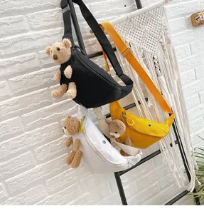 Canvas chest bag with cute plush bear pendant, casual crossbody waist bag for women and girls.