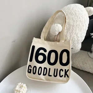 Canvas tote bag for women, casual single shoulder handbag with letter print, student daily use.