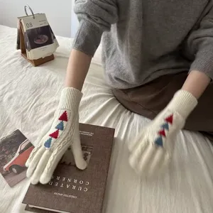 Knitted winter long gloves for women with cozy Christmas tree pattern in off white color.