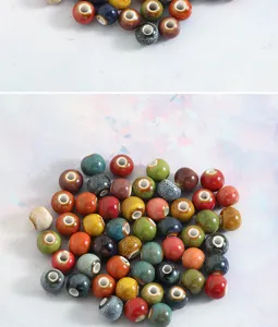 Detailed view of colorful glazed ceramic beads, large hole vintage DIY jewelry making materials.