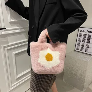 Chic pink fluffy plush handbag for women, cute floral winter shoulder bag with soft faux fur.