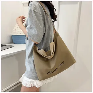 Retro canvas tote bag for women, large capacity shoulder and crossbody bag with stylish print.