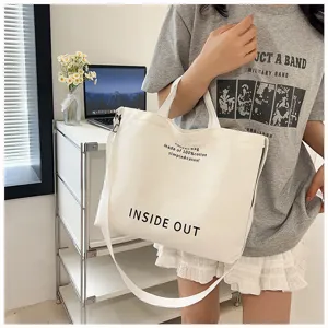 Canvas tote bag detail, white cotton crossbody bag featuring casual letter print, spacious style.