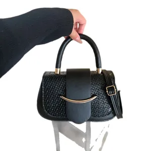 Stylish black women messenger bag with crocodile pattern and metal bar decor for daily wear.