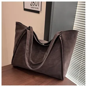 Detailed view of the vintage large capacity tote bag in dark brown soft texture fabric.