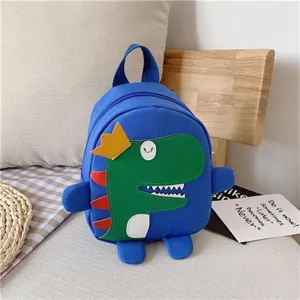Joli sac à dos dinosaure pour enfants, cartable bleu élégant avec design de dessin animé.