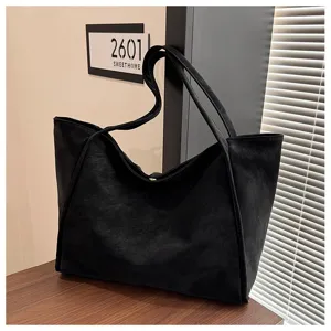 Detailed view of the black retro tote bag, showing large capacity and daily commuting style.